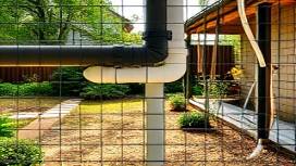 advanced PVC installation, content expression, securing a joint, photorealistic, residential backyard with garden, highly detailed, leaf falling, 24mm lens, earthy colors, dappled sunlight, shot with a Fujifilm X-T4